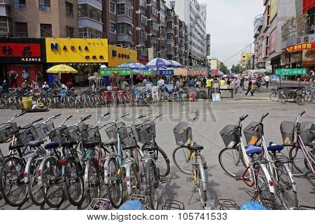 HOHOT, INNER MONGOLIA, CHINA - JULY 3, 2008: Dozens of bicycles - the most affordable transport for many residents - parked in the central business area