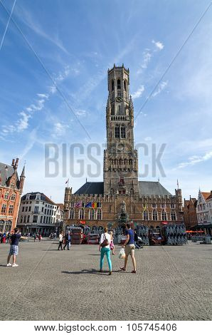 Bruges, Belgium - May 11, 2015: Tourist On Grote Markt Square In Bruges
