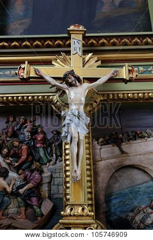 ZAGREB, CROATIA - MAY 28: Cross on the altar in the Basilica of the Sacred Heart of Jesus in Zagreb, Croatia on May 28, 2015