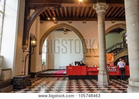 Bruges, Belgium - May 11, 2015: Tourists Visit Interior Of Museum Stadhuis On Burg Square In Bruges