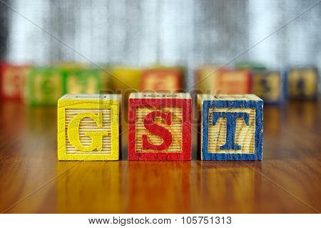 Word Of Gst Spelled With Colorful Wooden Alphabet Blocks.