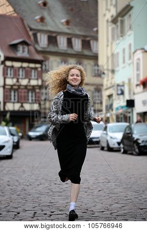 Blond Lady Running Along Street