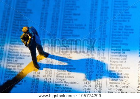 a small figure and the price of shares in a newspaper. making money on the stock exchange. gains and losses in equity trading.