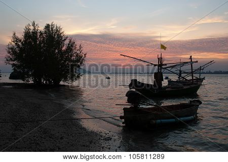 Fishermen Boat At Sunset In Thailand.