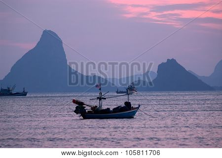Fishermen Boat At Sunset In Thailand.