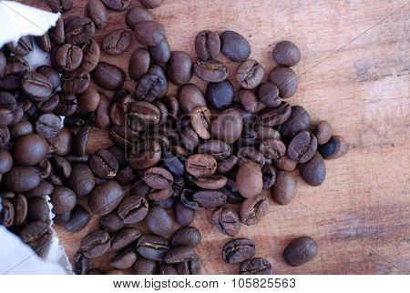 Roasted Coffee On A Wooden Background