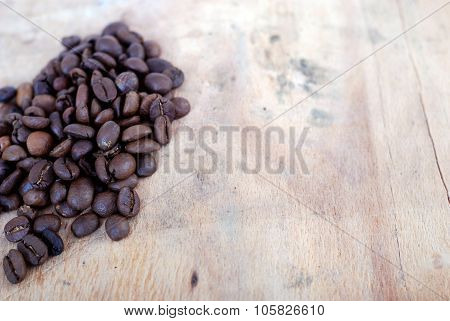 Roasted Coffee On A Wooden Background