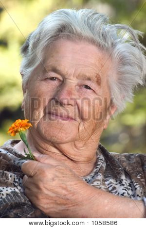 Elderly Woman With Flower