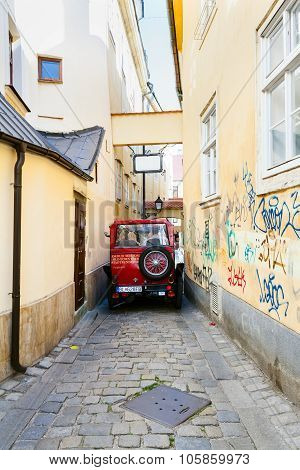 Sightseeing Bus On Narrow Street In Bratislava