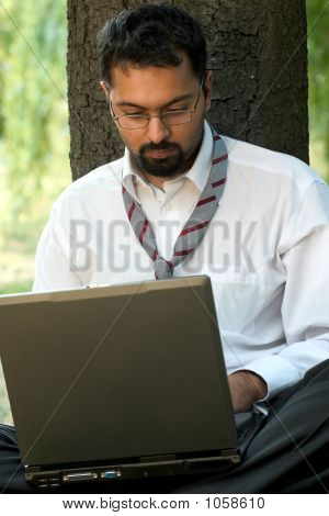 Indian Sitting With Laptop