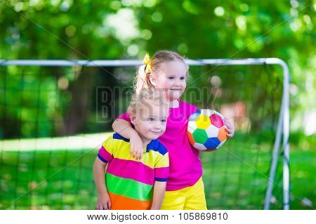 Kids Playing Football In School Yard