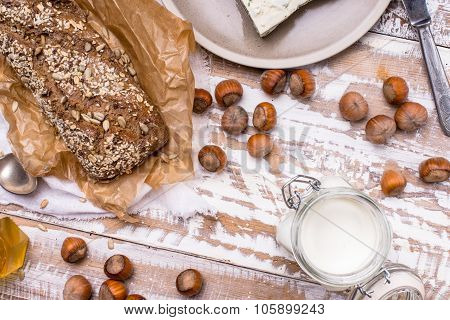 Healthy Meal Bread With Seeds Huzelnuts And Cheese On Table