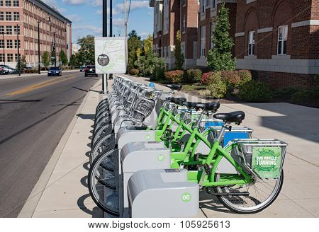 DAYTON, OHIO, USA-OCTOBER 18: Green Link bicycles stand in early morning light near University of Dayton waiting to be rented as part of Link: Dayton Bike Share program, Dayton, Ohio,October 18, 2015.