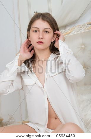 Portrait Of A Cute Girl On The Bed