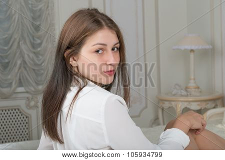 Portrait Of A Cute Girl On The Bed