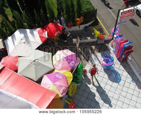Aerial view of umbrellas souvenirs and boy