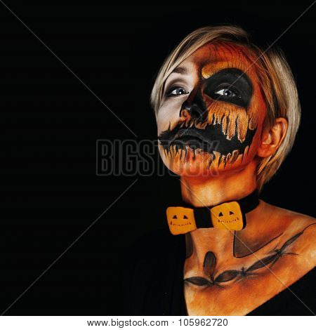 Halloween Portrait Of Body Art Pumpkin Girl With Pumpkin Bowtie On Black Background. Real Greasepain