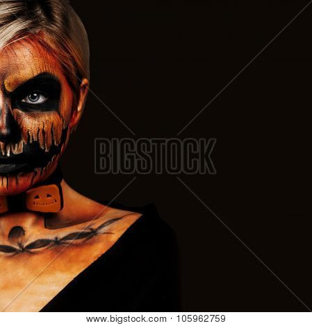 Halloween Portrait Of Body Art Pumpkin Girl With Pumpkin Bowtie On Black Background. Real Greasepain
