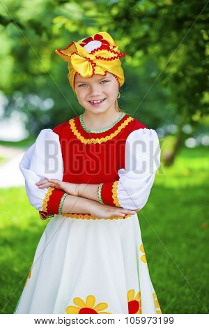 Close up Little girl is dressed in the Russian national dress Ã?Ã??Ã?Ã?? summer park