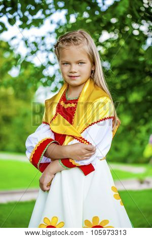 Close up Little girl is dressed in the Russian national dress Ã?Ã??Ã?Ã?? summer park