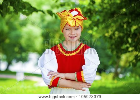 Close up Little girl is dressed in the Russian national dress Ã?Ã??Ã?Ã?? summer park