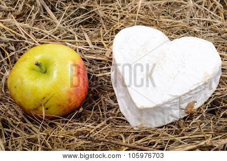Neufchatel cheese heart shape, on straw
