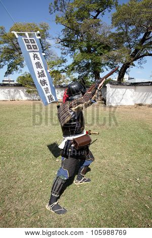 Japanese samurai with fire-lock rifle