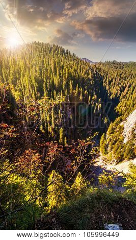Steep Cliff In Romanian Mountains At Sunset