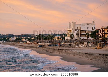 ALBANIA GOLEM- September 21 2015: Evening beach at sunset in the resort of Golem on the Adriatic coast.