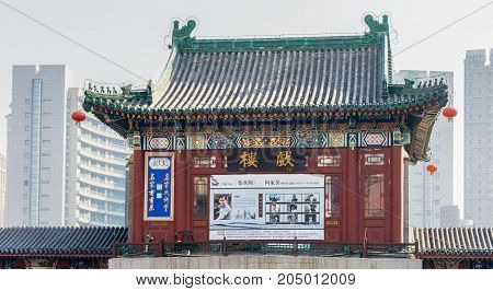 Tianjin, China - Nov 1, 2016: Tianjin Ancient Cultural Street, preserved in the classical Qing Dynasty architectural style. Morning scene at gate structure to what is a very popular tourist area.