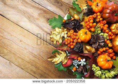 Fall Arrangement With Frame Of Pumpkins, Berries And Cones