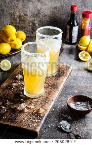 Drink Michelada chilena. Traditional Latin American chilean mexican refreshing beer drink with lemon, salt and ice.