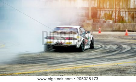 Abstract blurred car drift on speed track with smoke