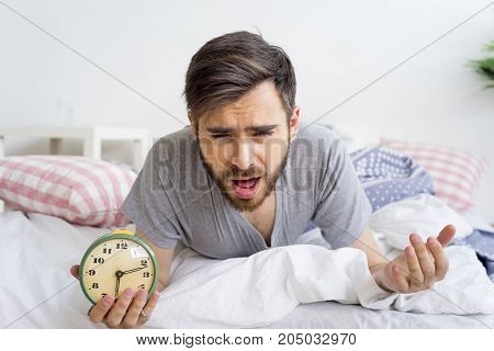 A man is overslept, he missed the alarm