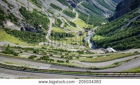 Top view of serpentine road and galleries of Stelvio Pass from above. Bormio side