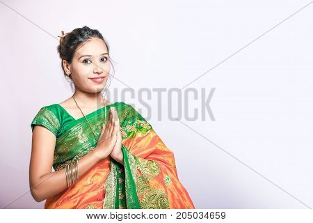 Happy young beautiful traditional Indian woman in traditional saree