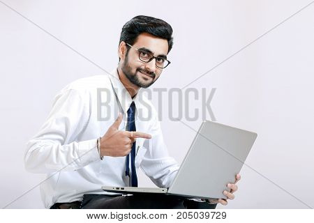 young indian businessman   with laptop