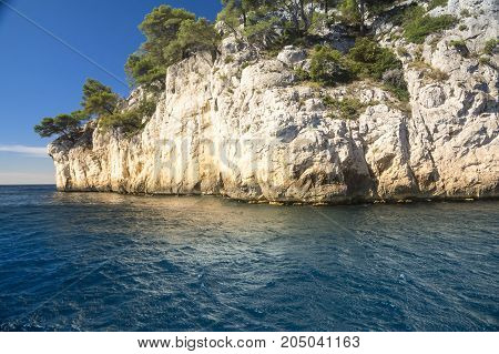 View from the sea of a part of the natural park of the creeks near the French city of Cassis during a sunny day