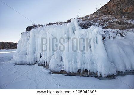 Icicles In Rock. Lake Baikal. Winter
