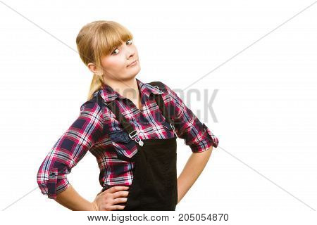 Gardening fahion concept. Attractive woman in pink check shirt and dungarees shocked surprised face expression. Isolated background