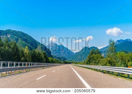 country road at the european alps mountains