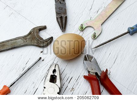 saying if it ain't broke don't fix it metaphor with whole egg and tools