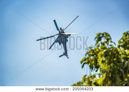 ROSTOV-ON-DON, RUSSIA - CIRCA AUGUST, 2017: Russian Air Force Mil Mi-28 Havoc military attack combat helicopter in gray camouflage flying detail exterior front close up aerial view