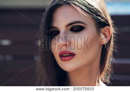 Beautiful model girl with an evening make-up . Woman with fashion style makeup. Smoky eyes.