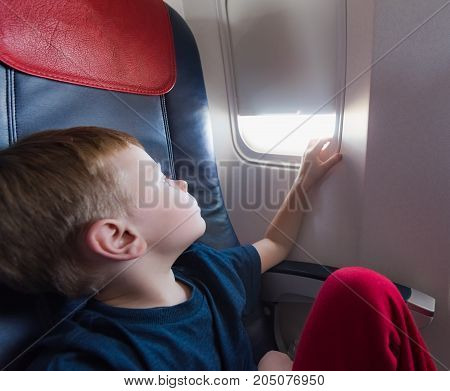 In The Cabin Of The Plane The Boy