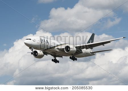 LONDON, UK - AUGUST, 3 2013; A Pakistan International Airlines (PIA) Boeing 777-240(ER) lands at Heathrow Airport in London