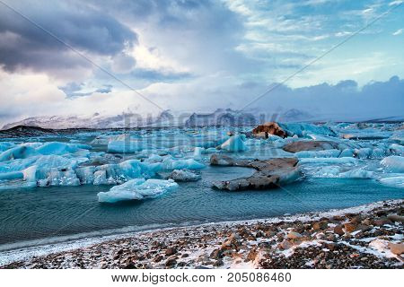 Icebergs drifting to sea in Jokulsarlon during winter. Jokulsarlon - Iceland
