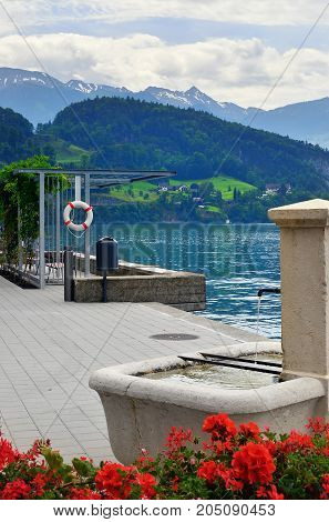 Beautiful view on the lake Luzern and pier in the city of Vitznau Switzerland