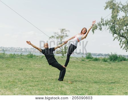 Sportt life and health concept. Yoga time on summer day.