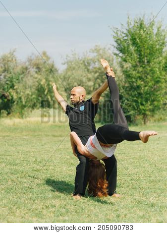 Sportt life and health concept. Yoga time on summer day.